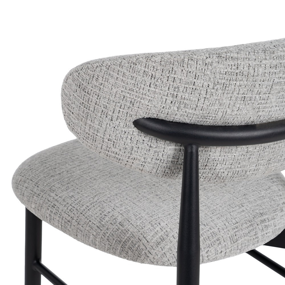 Taburete tapizado gris con estructura metálica